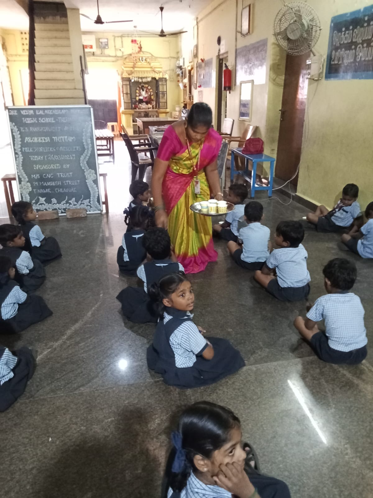 Children receiving milk at school